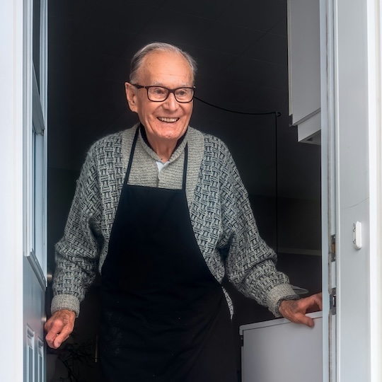 Confident silver-haired woman with a motorcycle